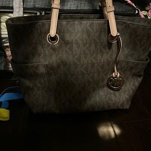 Michael Kors brown leather large size bag purse with gold details